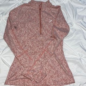 Gymshark half zip pullover with back cut-out.